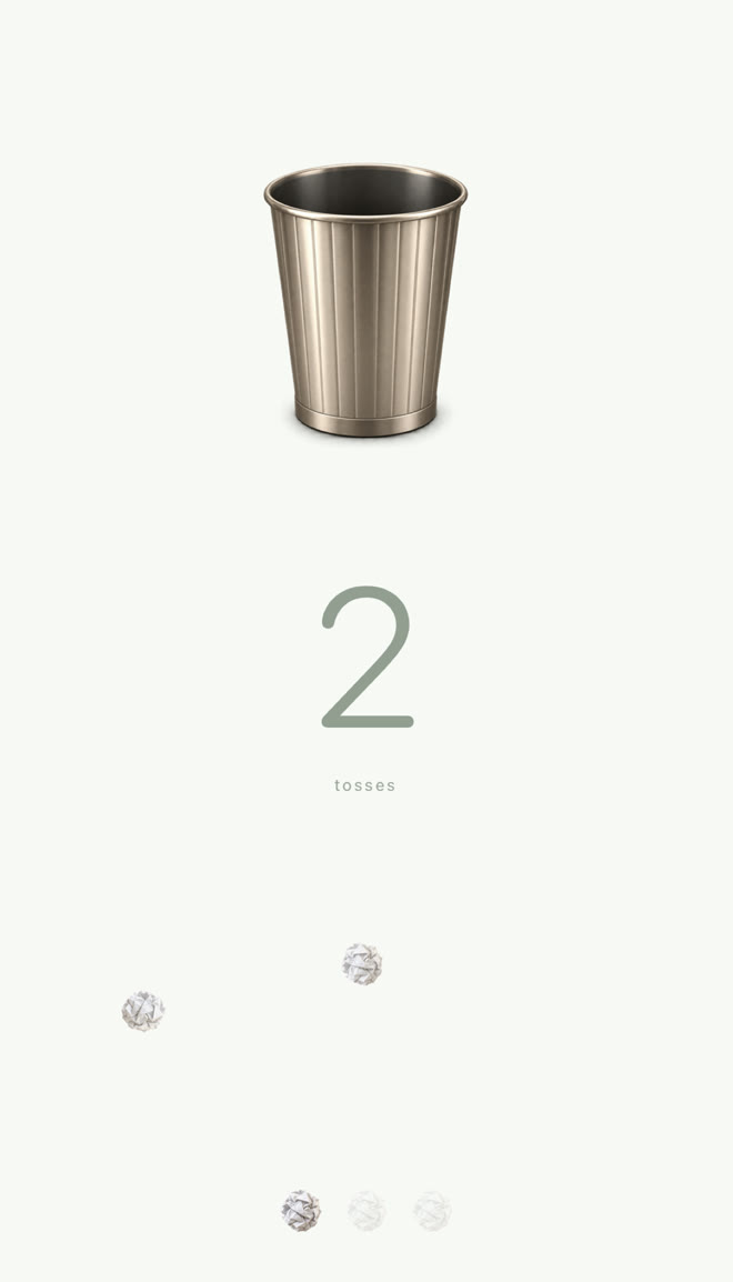 A paper ball in flight above the bin, score showing two tosses.